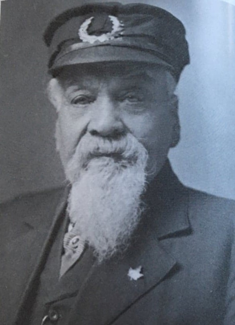 A Black man in a police uniform.